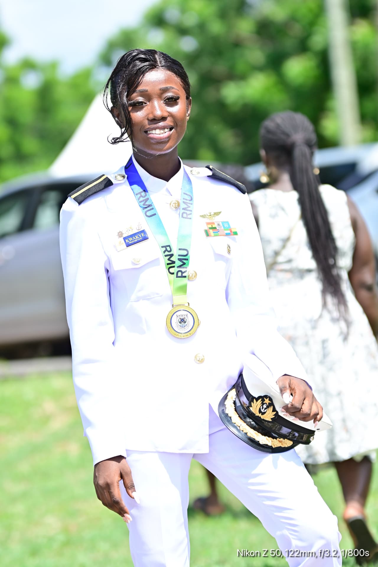 Cadet officer in full white merchant navy dress uniform with peaked cap